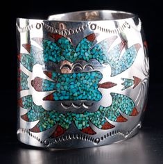 Vintage 1970's Sterling Silver Navajo Inlay Turquoise Coral Bird Cuff BraceletMetal Information: Sterling SilverTotal Weight: 85.3gBracelet Width: 2"Bracelet Length: 6" (Opening: 1.5")Circa: 1970'sArtist: B. EENStone InformationMain StoneGem Type: TurquoiseShape: InlayColor: Blue / GreenAccent StonesGem Type: CoralShape: InlayColor: RedEstimated Retail Price: $1400.00OUR PRICE: $1120.0044651 Southwestern Turquoise Bangle, Southwestern Turquoise Cuff Bracelet With Inlay, Southwestern Style Turquoise Cuff Bracelet With Inlay, Metal Cuff Bracelet, Jewelry Website, Coral Turquoise, Custom Jewelry Design, Metal Bracelets, Estate Jewelry