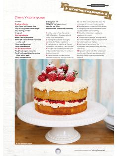 a cake with strawberries on top is sitting on a white plate and has information about it