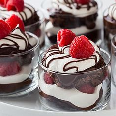 an image of desserts with chocolate and raspberries in them on a plate