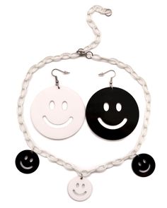 Introducing the All Smiles Earrings, a must-have accessory for your next rave or music festival! These handmade earrings are laser-cut in-house, ensuring the highest quality and attention to detail. With their unique design featuring one black and one white smiley face, these earrings are guaranteed to turn heads and spread smiles wherever you go. Don't forget to check out our matching belt and choker, available in a separate listing, to complete your All Smiles Collection ensemble. All Smiles E Face Earrings, Smiley Faces, Lasercut Design, Acrylic Charms, Festival Looks, Fun Events, White Colors, All Smiles, Black And White Colour