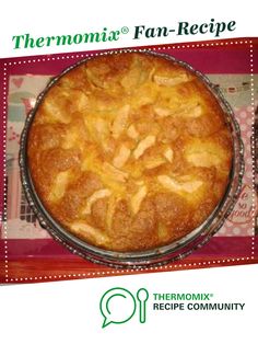 there is a pie with apples on it and the words thermomiia fan - recipe