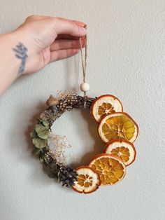 an orange wreath hanging on the wall