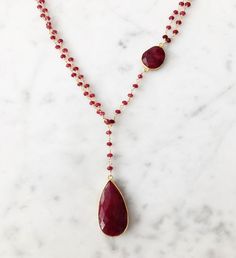 Diana Necklace Ruby with Ruby Drop / Ruby | A Blonde and Her Bag The Diana Montecito Necklace is a long, 28" plus 6" drop in length, semi- precious stone necklace An 18k gold vermeil bezel set central round semi- precious stone | 1-800-Flowers Gifts Delivery Diana Necklace Ruby W/ Ruby Drop Gold Lariat Necklace With Gemstone Beads, Gold Drop Necklace With Gemstone Accents, Gold Lariat Necklaces With Gemstone Beads, Elegant Drop Necklace With Briolette Natural Stones, Briolette Necklace With Natural Stones For Anniversary, Elegant Briolette Drop Necklace With Natural Stones, Luxury Drop Lariat Necklace Gift, Luxury Drop Lariat Necklace As Gift, Anniversary Briolette Necklace With Natural Stones