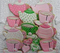 decorated cookies in the shape of teapots and cups