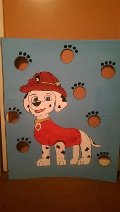 a painting of a dog wearing a fireman's hat with paw prints on it