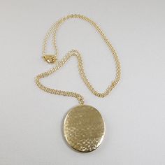 Keep pictures of your loved ones close to your heart with this lovely textured oval photo locket necklace. The necklace is made with a large textured gold plate oval shaped photo locket that is suspended on 14k gold filled chain and 14k gold filled lobster clasp. This locket is larger than the average photo locket. The average photo locket size is 3/4th of an inch or smaller. This locket is an inch and three quarters long (1.75”) and one and a half inch wide (1.5”).Available in six necklace leng Oval Locket Necklace, Floating Pearl Necklace, Teardrop Pearl Earrings, Cloisonne Jewelry, Cremation Necklaces, Photo Locket Necklace, Oval Locket, Jewelry Lockets, Photo Necklace