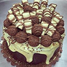 a cake with chocolate and white frosting on top