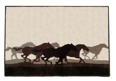 a group of horses running across a field