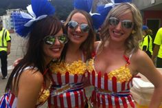 three women in striped bathing suits posing for the camera