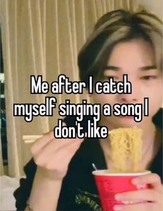 a girl is eating some food and drinking something from a cup with the caption me after i catch my self singing a song i don't like