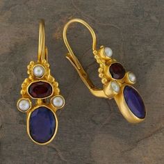 For some one who prize parity, quality and beauty.  The Victorians were brilliant at dressing up occasions with a melange of beautiful stones. A deep blue lapis stone is adorned with a turban of garnet and freshwater pearls accented with vermeil (24k gold over sterling silver) granules.  European backs for pierced ears. Size 1 1/8 inch. Elegant Sapphire Multi-stone Earrings, Elegant Blue Stone Earrings, Elegant Blue Earrings With Stones, Elegant Sapphire Earrings With Natural Stones, Elegant Earrings With Gemstone Accents For Festive Occasions, Garnet And Pearl, Iolite Stone, Lapis Stone, Lapis Earrings