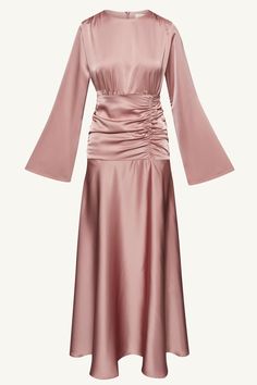 Indulge in luxury and sophistication with our Shams Satin Side Rouched Maxi Dress in Dusty Rose. The elegant hue is enhanced by the side rouched detailing, creating a flattering silhouette. The dramatic flare sleeves add a touch of drama and femininity to this must-have piece. Model is 5'7" and is wearing size XS/58". Dress Rose Gold Hijab, Feminine Midi Dress With Gathered Sleeves For Party, Glamorous Ruched Midi Dress For Dinner, Party Dress With Draped Gathered Waist, Draped Evening Dress With Gathered Waist, Evening Dress With Gathered Waist And Draped Design, Evening Dress With Gathered Waist And Draped Shape, Elegant Pink Dress With Gathered Sleeves, Elegant Pink Dress With Ruched Back