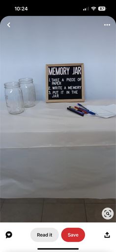 a table with some jars and a sign on it that says, memory jar i am a piece of write a memory save