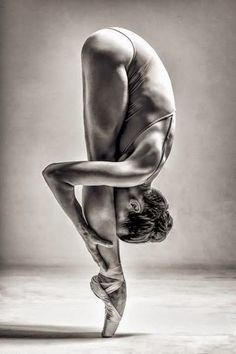 black and white photograph of a ballerina doing a handstand