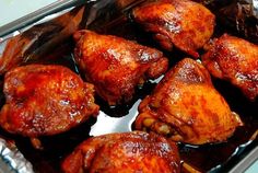 chicken wings are cooked in the oven and ready to be eaten with sauce on them