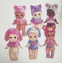 a group of cartoon bears standing next to each other on top of a white sheet