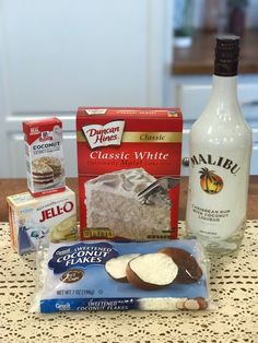 the ingredients to make an ice cream cake are displayed on a table with lace doily