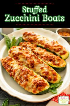 stuffed zucchini boats on a white plate