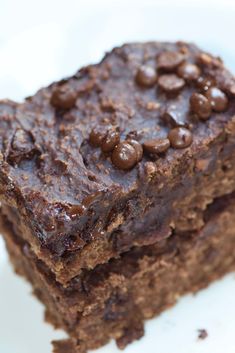 two pieces of chocolate brownie on a white plate