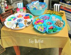 the table is full of toys and crafts for kids to play with in their home