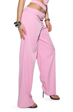 Influenced by traditionally polished tailoring, these pinstriped wide-leg pants are revamped in bubblegum pink and boast a Y2K-inspired split waistband. 31" inseam; 22" leg opening; 11" front rise; 14" back rise (size Medium) 96% polyester, 4% elastane Dry clean or machine wash, line dry Imported Spring Wide Leg Pants With Vertical Stripes, Spring Wide-leg Pants With Vertical Stripes, Spring Striped Wide Leg Pants, Stretch Pants With Vertical Stripes For Spring, Pinstripe High-waisted Pants For Spring, Trendy Pinstripe Wide Leg Bottoms, Trendy Pinstripe Wide Leg Pants, Spring Pinstripe Trousers, Pinstripe Wide Leg Summer Bottoms