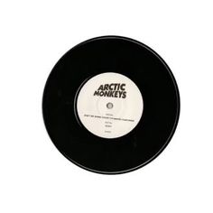 an arctic monkeys record on a white background