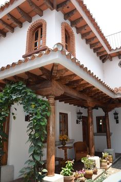 an outdoor patio with potted plants on it