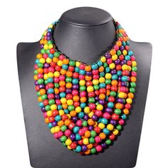 Add a pop of color to your wardrobe with this unique and eye-catching wooden beaded necklace! Handmade with love, this piece features a variety of vibrant wooden beads in a range of colors and sizes, with diameters ranging from 3-5mm. The necklace measures 48cm in perimeter and weighs approximately 100g, making it a comfortable and lightweight addition to any outfit. The boho & hippie style of this piece is perfect for adding a touch of earthy, natural charm to your look, while the tribal-inspir Boho Hippie Style, Hippie Stil, Beaded Necklace Patterns, Bohemian Colors, Bold Accessories, Necklace Patterns, Bohemian Necklace, Festival Looks, Necklace Boho