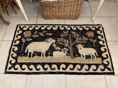 a rug with sheep and flowers on it