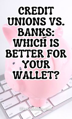 a piggy bank sitting on top of a computer keyboard with the words credit unions vs banks which is better for your wallet?