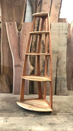 a wooden shelf sitting on top of a cement floor