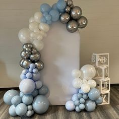 an arch made out of balloons on the floor