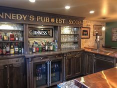 the inside of a pub with lots of liquor