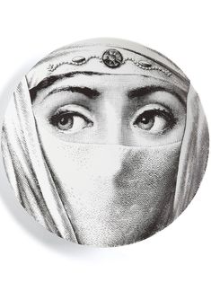 a black and white drawing of a woman's face with her head covered by a veil