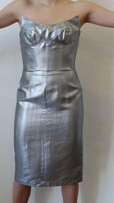 For Sale on 1stDibs - The most amazing Thierry Mugler couture dress from the Spring 1989 collection! Silver sculpted silhouette with detailed stitching along the bodice. Unique, Luxury Fitted Metallic Dress, Luxury Metallic Fitted Dresses, Fitted Silver Silk Dress, Sculpture Dress, Thierry Mugler Couture, Mugler Couture, Silver Sculpture, Structured Corset, David Lachapelle