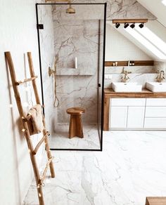 a bathroom with a ladder in the middle of it