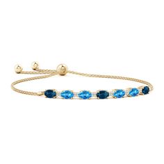 Oval London and Swiss blue topazes in an alternated pattern, create a vibrant combination of blue hues. They are accentuated with dazzling diamond accents. This alluring bolo bracelet in 14k yellow gold is adjustable to fit most wrists. Tanzanite Bracelet, Bluish Purple, Bolo Bracelet, Blue Topaz Bracelet, Swiss Blue Topaz, London Blue Topaz, London Blue, Blue Hues, Delicate Bracelet