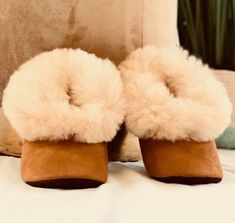 Unisex alpaca slippers from Peru!The unisex Luxurious Alpaca Fur Slippers keep your feet nice and cozy even on the most blustery winter’s eve. These fur slippers are very well made, ensuring they will last for years.These baby alpaca slippers are made from the finest Alpaca fur and are guaraunteed to keep ones feet warm this winter.Material: Alpaca outer, sheepskin wool lines the inside, bottom suedeBenefits and Features:– No animal was ever harmed to make these items.– Each one is totally uniqu Cozy Winter Slippers With Soft Sole, Comfortable Fluffy Slippers With Round Toe, Soft Faux Fur Slippers With Round Toe, Fluffy Slip-on Slippers For Indoor Use, Fluffy Comfortable Round Toe Slippers, Super Soft Brown Indoor Slippers, Fluffy Slip-on Indoor Slippers, Fluffy Round Toe Comfortable Slippers, Indoor Slippers With Faux Fur Lining And Round Toe