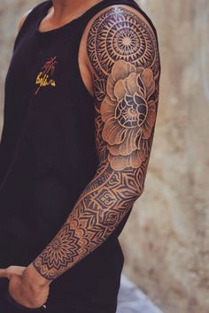 a man with a tattoo on his arm