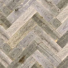 an image of wood flooring that looks like chevroned herringbones in grey and white