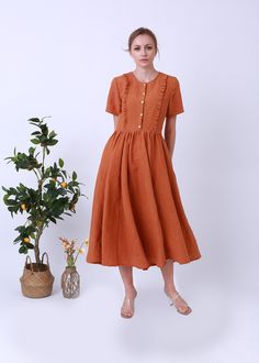 "It was a scoop neck linen dress , and a vintage look. It is ideal for daily wear, party, travel, work, school, indoors and outdoor walks, spending time with family, shopping, etc.The dress is exceptionally comfortable and soft. DETAIL - 100% linen, soft washed - Medium weight linen - Short Sleeves - No lining, Don't see through - retro style -Colour: Ochre Choose CUSTOM Order if you * Need a better fit * Can't find your size in our size Chart * Change the Style * Change the long We do make cust Brown Buttoned Summer Dresses, Brown Summer Dresses With Buttons, Spring Linen Buttoned Dress, Casual Brown Linen Summer Dress, Vintage Linen Dress For Spring, Spring Vintage Linen Dress, Summer Brown Linen Daywear Dress, Brown Linen Spring Dress, Elegant Brown Linen Summer Dress