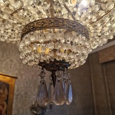 a chandelier hanging from the ceiling in a room