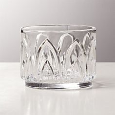 a clear glass bowl sitting on top of a table