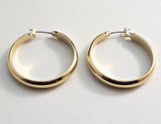 Monet wide band classic hoop surgical steel post pierced stud earrings vintage polished smooth reflective domed open large dangle rings. In excellent never worn still on the card condition. Measures 1 1/8 of an inch wide and long. Classic Metal Hoop Earrings For Anniversary, Classic Nickel-free Hoop Earrings For Wedding, Dangle Rings, Stud Earrings Gold, Costume Earrings, Steel Post, Earrings Vintage, Wide Bands, Gold Earrings Studs