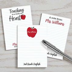 three notepads with writing on them and an apple in the middle next to a pen