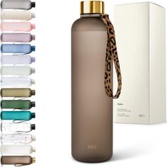 thermos bottle with leopard print strap is next to its box and packaging material