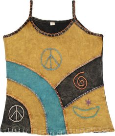 A bohemian style stonewashed tank top with patches of mustard, black and teal colors joined together with a thick thread.  The patches look very artsy, especially with the symbolic embroidered motifs highlighting the overall look. #tlb #Sleeveless #Stonewash #Embroidered #vacationclothing #beachwrap #bohemianfashion #Handmade #Gypsytanktop #Hippietanktop #PeaceDresstop Hippie Multicolor Tank Top For Festival, Hippie Cotton Tank Top, Multicolor Patchwork Casual Tank Top, Hippie Sleeveless Patchwork Tops, Casual Tops With Multicolor Embroidery And Patchwork, Multicolor Cotton Patchwork Tank Top, Casual Multicolor Patchwork Tank Top, Bohemian Patchwork Tank Top For Summer, Hippie Brown Cotton Top