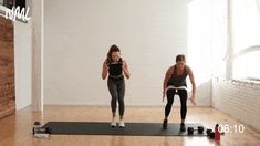 two women doing exercises on exercise mats in an empty room with brick walls and wood flooring