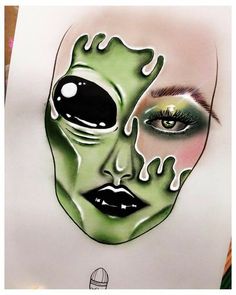 a drawing of a woman's face with green makeup