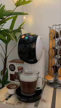 a coffee maker sitting on top of a wooden table